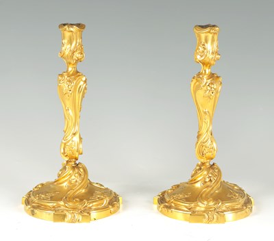 Lot 622 - A FINE PAIR OF FRENCH ROCOCO GILT BRONZE CANDLESTICKS IN THE MANNER OF FRANCOIS LINKE