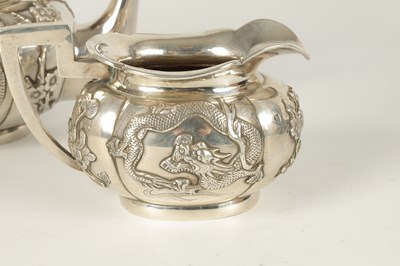 Lot 206 - AN EARLY 20TH CENTURY CHINESE SILVER THREE PIECE TEA SERVICE