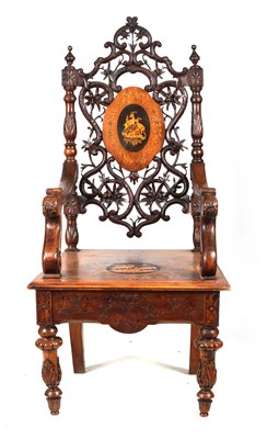 Lot 441 - A 19TH CENTURY SWISS/BLACK FOREST CARVED WALNUT MUSICAL ARMCHAIR