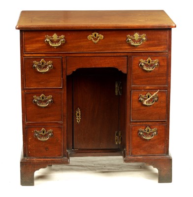 Lot 1065 - A GEORGE III MAHOGANY KNEEHOLE DESK