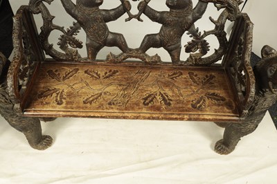 Lot 450 - A 19TH CENTURY BLACK FOREST CARVED TWO SEATER HALL BENCH