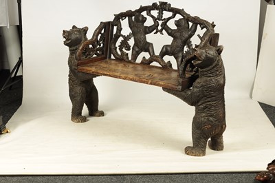 Lot 450 - A 19TH CENTURY BLACK FOREST CARVED TWO SEATER HALL BENCH