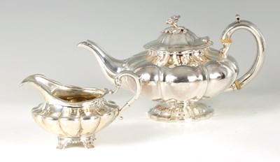 Lot 322 - A REGENCY SILVER TEAPOT AND CREAM JUG