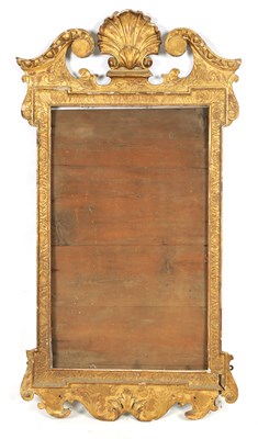 Lot 1100 - A GEORGE II GILT GESSO CARVED HANGING MIRROR FRAME