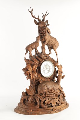 Lot 794 - A LARGE LATE 19TH CENTURY CARVED BLACK FOREST MANTEL CLOCK