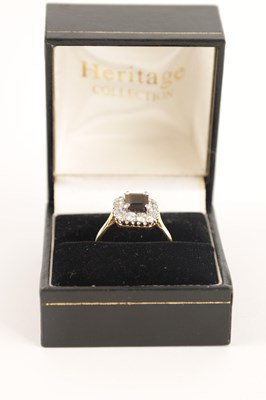 Lot 240 - A LADIES 18CT GOLD AND PLATINUM GARNET AND DIAMOND RING