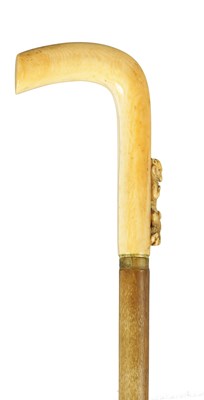 Lot 390 - A 19TH CENTURY RHINOCEROS HORN AND IVORY MOUTED WALKING STICK