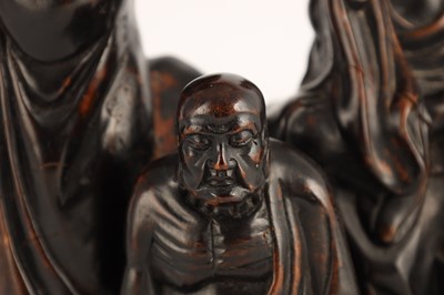 Lot 230 - AN EARLY CHINESE CARVED HEAVY HARDWOOD FIGURAL SCULPTURE