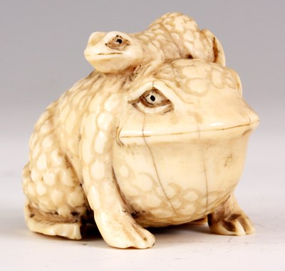 Lot 90 - AN IVORY NETSUKE IN THE FORM OF A TOAD WITH...