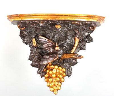 Lot 655 - A 19TH CENTURY CONTINENTAL CARVED STAINED WOOD AND GILT HANGING BRACKET