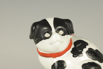 Lot 33 - A PAIR OF CONTINENTAL SEATED PUG DOGS