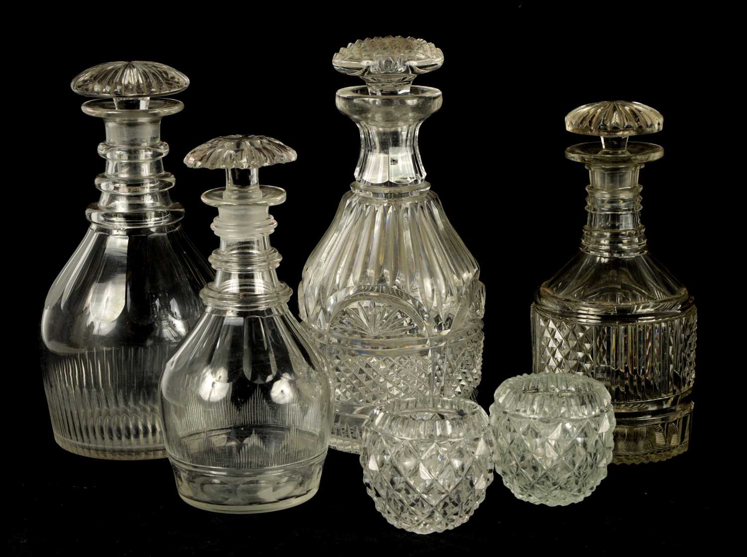 Lot 14 - A COLLECTION OF FOUR LATE GEORGIAN CUT GLASS DECANTERS