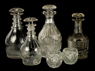 Lot 241 - A COLLECTION OF FOUR LATE GEORGIAN CUT GLASS DECANTERS