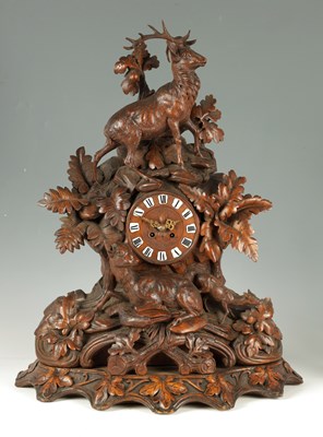 Lot 915 - A LARGE LATE 19TH CENTURY CARVED BLACK FOREST MANTEL CLOCK