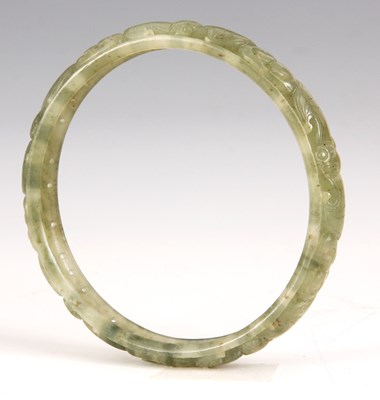 Lot 105 - AN ORIENTAL JADE BANGLE with pierced and...
