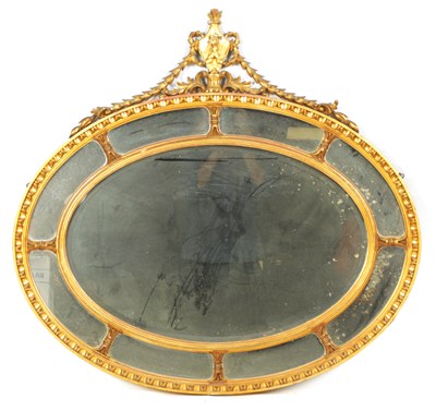 Lot 1084 - A 19TH CENTURY GILT GESSO ADAM STYLE OVAL HANGING MIRROR