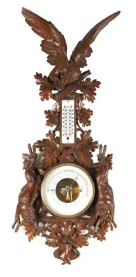 Lot 918 - A LARGE 19TH CENTURY BLACK FOREST CARVED BAROMETER