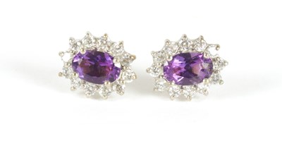 Lot 251 - A PAIR OF LADIES 9CT GOLD AMETHYST AND DIAMOND EARINGS
