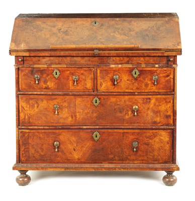 Lot 795 - AN EARLY WILLIAM AND MARY FIGURED WALNUT BUREAU