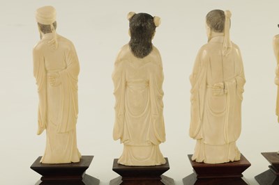 Lot 117 - A COMPLETE SET OF EIGHT MEIJI PERIOD JAPANESE IVORY CARVED OKIMONOS