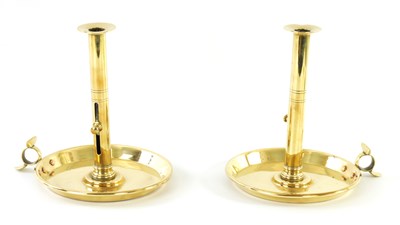 Lot 339 - A PAIR OF GEORGE III OVERSIZED REFECTORY BRASS CANDLESTICKS