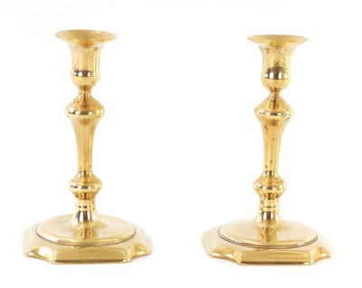 Lot 148 - A PAIR OF MID 18TH CENTURY CAST BRASS CANDLESTICKS