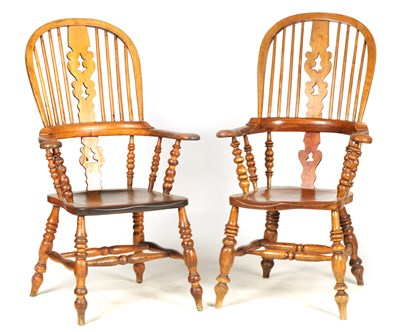 Lot 970 - A PAIR OF 19TH CENTURY ASH AND EML HIGHBACK BROAD ARM WINDSOR CHAIRS