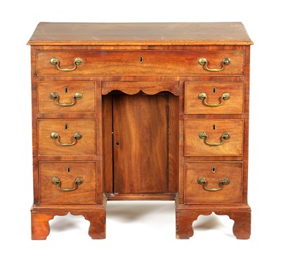 Lot 1003 - A GEORGE III MAHOGANY KNEEHOLE DESK