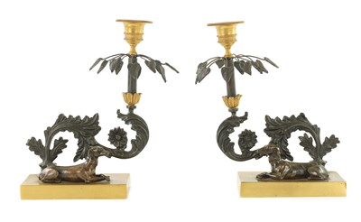 Lot 386 - A PAIR OF LATE 19TH CENTURY REGENCY STYLE BRONZE AND GILT BRONZE CANDLESTICKS