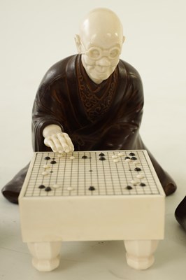 Lot 152 - A JAPANESE MEIJI PERIOD BRONZE AND IVORY FIGURAL GROUP OF THREE ELDERS PLAYING GO & GO BANG GAME