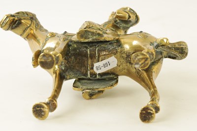 Lot 81 - AN EARLY PERIOD CHINESE CAST BRASS MODEL OF A KNIGHT ON HORSEBACK