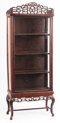 Lot 192 - A CHINESE HARDWOOD DISPLAY CABINET with...