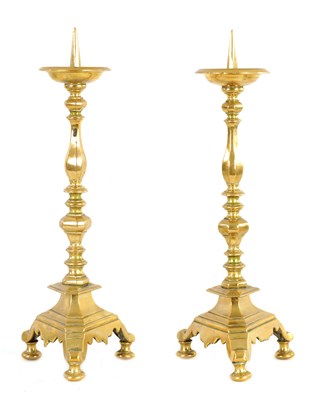 Lot 342 - A PAIR OF 18TH CENTURY DUTCH BRASS PRICKET CANDLESTICKS