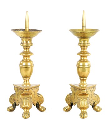 Lot 338 - A PAIR OF 17TH/18TH CENTURY CONTINENTAL CAST BRASS PRICKET CANDLESTICKS