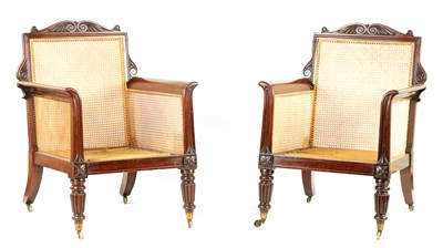 Lot 757 - A FINE PAIR OF REGENCY BERGERE LIBRARY CHAIRS IN THE MANNER OF GILLOWS