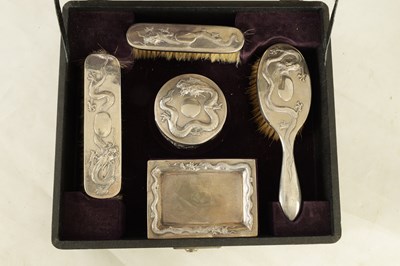 Lot 87 - AN EARLY CHINESE EXPORT CASED SILVER DRESSING TABLE SET