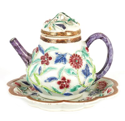 Lot 74 - A 19TH CENTURY CHINESE HIGH RELIEF FAMILLE ROSE TEAPOT AND COVER ON STAND