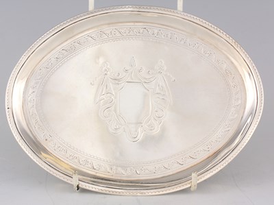 Lot 238 - A GEORGE III OVAL BRIGHT CUT ENGRAVED SILVER TEAPOT STAND