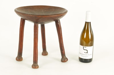 Lot 635 - A 19TH CENTURY AFRICAN TRIBAL HARDWOOD STOOL