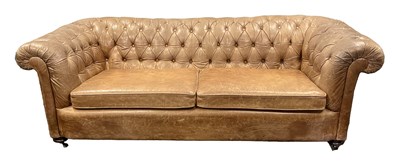 Lot 1036 - A THREE SEATER BROWN LEATHER CHESTERFIELD SETTEE