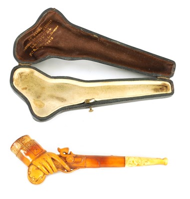 Lot 352 - A 19TH CENTURY MEERSCHAUM PIPE DEPICITING A HAND HOLDING A PISTOL