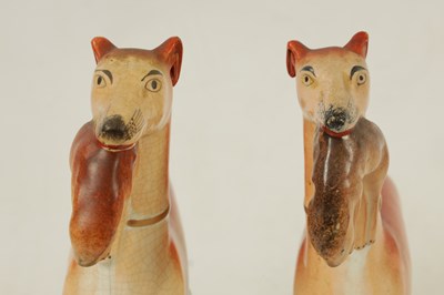 Lot 147 - A LARGE PAIR OF 19TH CENTURY STAFFORDSHIRE GREYHOUNDS