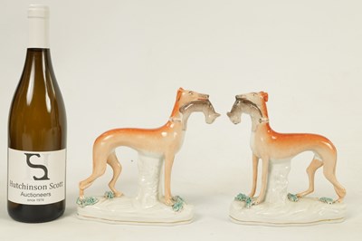 Lot 159 - A PAIR OF  19TH CENTURY STAFFORDSHIRE GREYHOUNDS