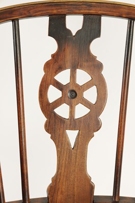 Lot 725 - AN EARLY 19TH CENTURY ELM AND ASH THAMES VALLEY WINDSOR CHAIR
