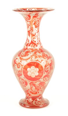 Lot 44 - A LATE 19TH CENTURY BOHEMIAN ETCHED AND CUT RUBY GLASS VASE