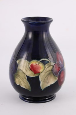 Lot 18 - A WALTER MOORCROFT SMALL BULBOUS FOOTED VASE