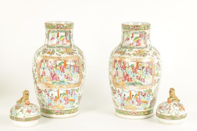 Lot 61 - A PAIR OF 19TH CENTURY CANTON OVOID VASES WITH DOME COVERS AND DOG O FOE FINIALS