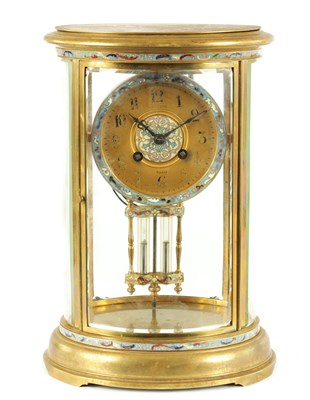 Lot 557 - A LATE 19TH CENTURY FRENCH OVAL BRASS AND CHAMPLEVE ENAMEL MANTEL CLOCK