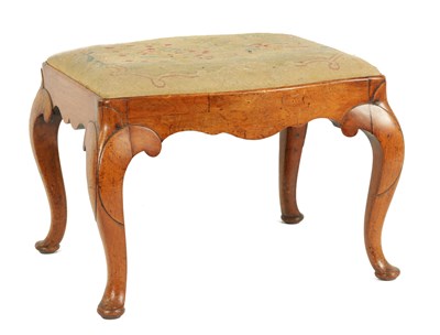 Lot 694 - A GEORGE II SERPENTINE SHAPED WALNUT STOOL