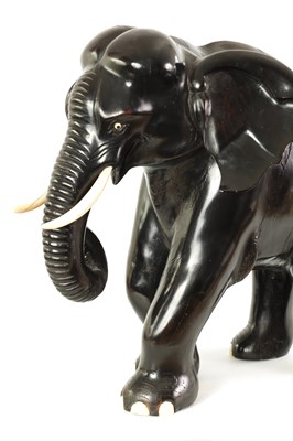 Lot 160 - A LARGE LATE 19TH CENTURY ANGLO-INDIAN CARVED EBONY ELEPHANT